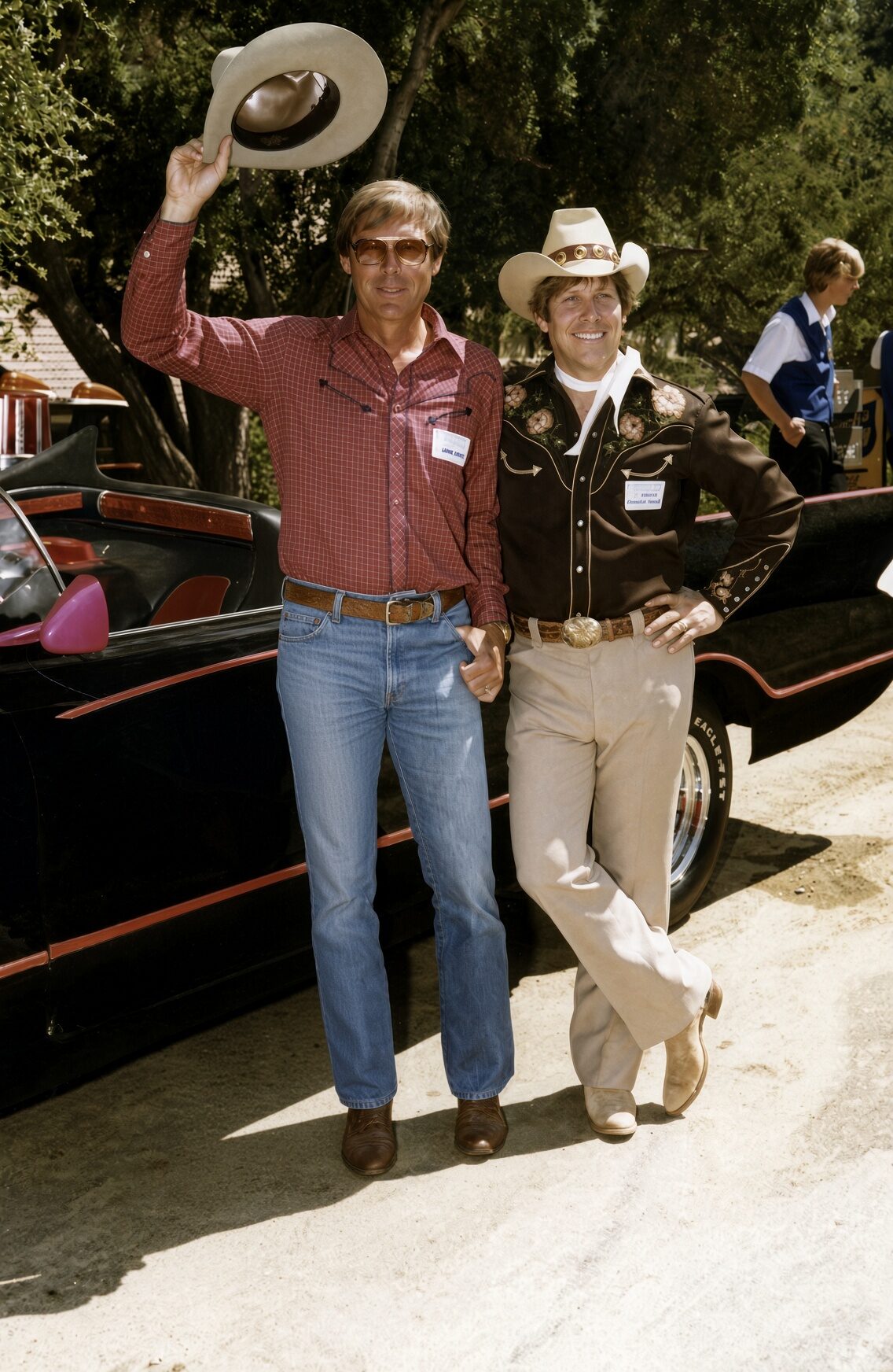 Adam West and Steve Goldfield beside the original Batmobile