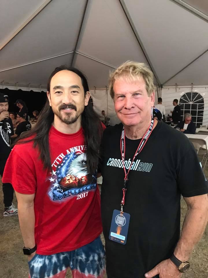 Steve Aoki and a man posing for a photo.